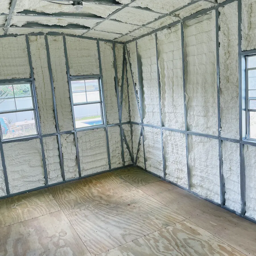 Closed-cell spray foam insulation applied to wall cavities in a residential project in Green Bay